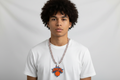 Person facing forward wearing a custom 3D printed New York Knicks hype chain necklace